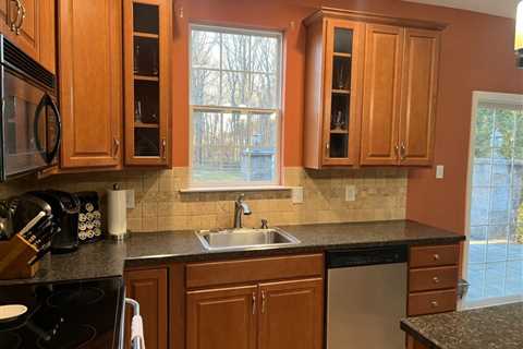 Professionally painted kitchen cabinets before and after - Spinelli Signs and Painting